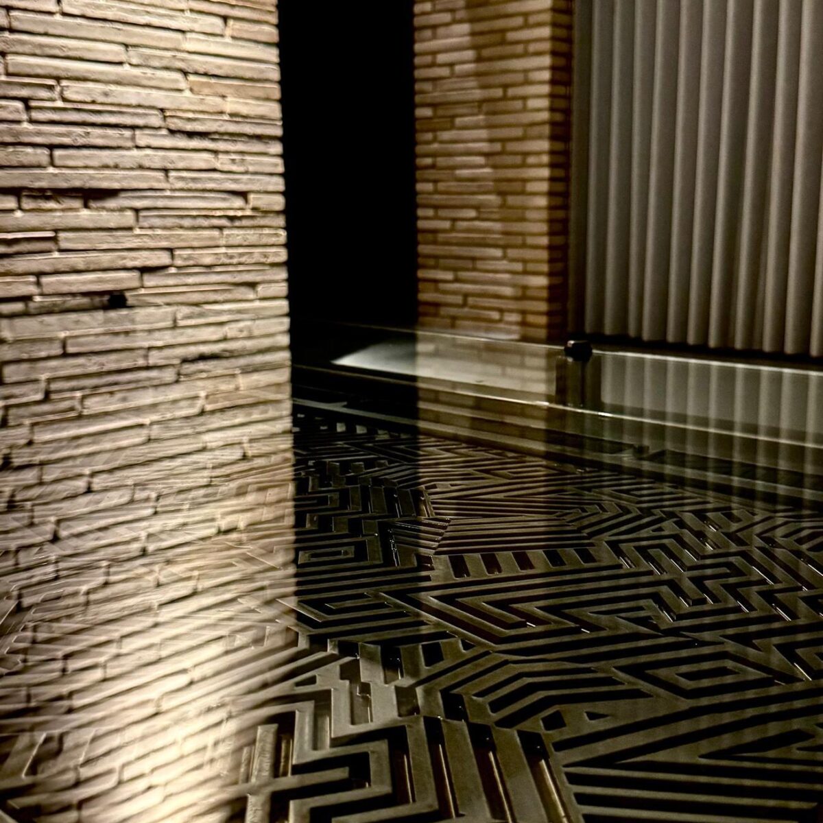 Labyrinth pattern steel feature panel