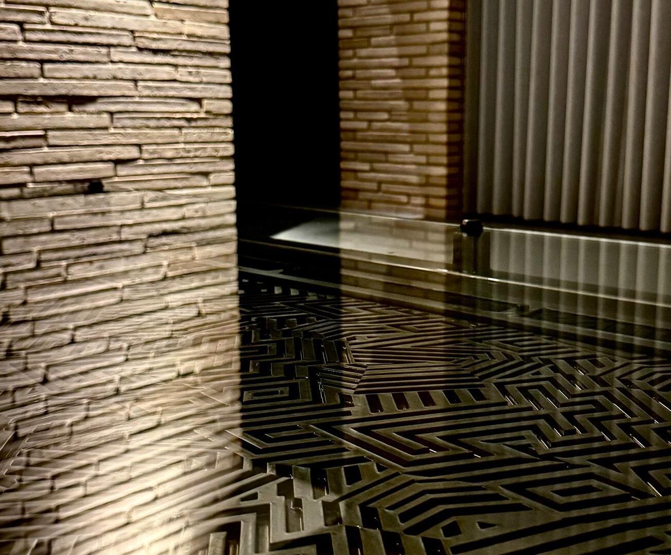 Labyrinth pattern steel feature panel