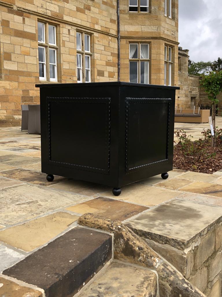Riveted steel planter detail